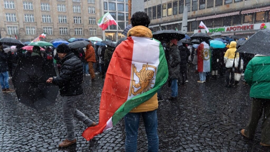 Iran, grappling with protests, vows retaliation to any US attack